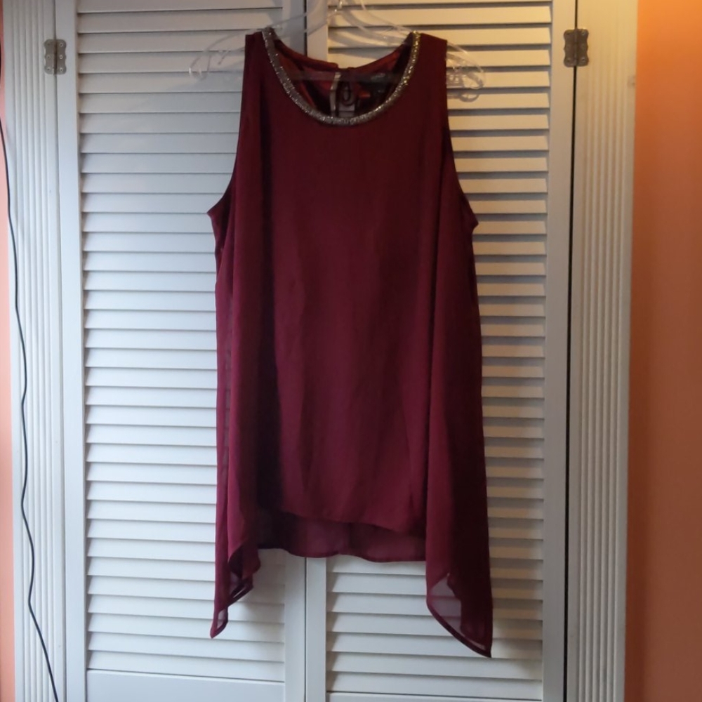 Shirt with an attached necklace